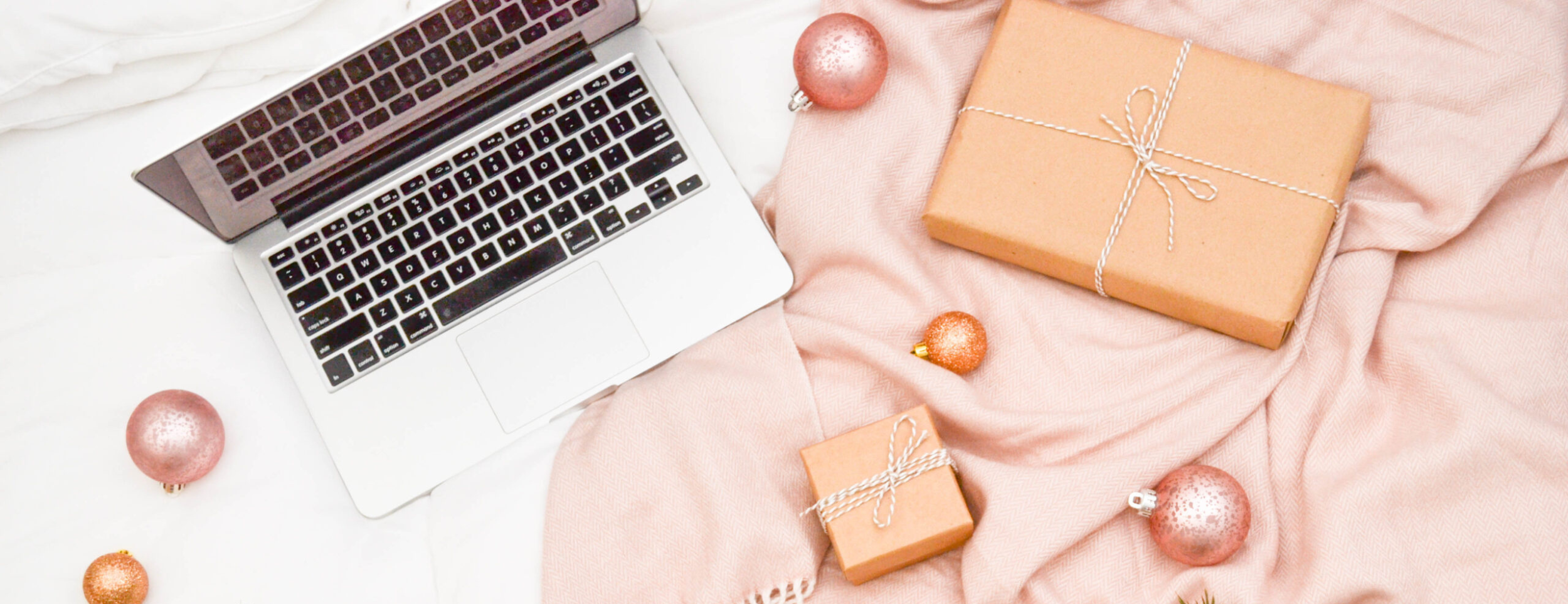 Image of a computer and holiday decorations.
