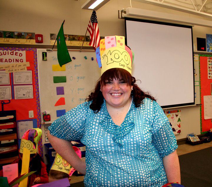 An image of Alexis from her days in the classroom, wearing a 100 days of school hat